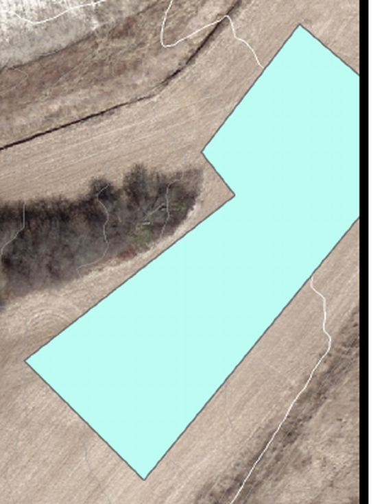 Aerial photo showing tree cover reducing GNSS accuracy near the site boundary